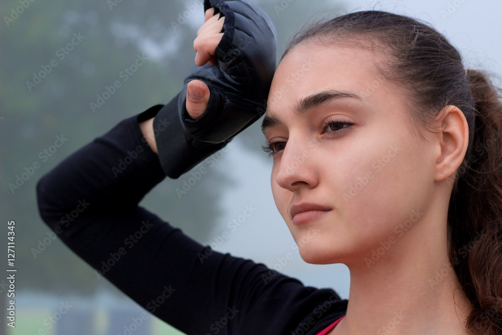 Young fitness woman rests during boxing training workout outdoor Young fitness woman rests during boxing training workout outdoor