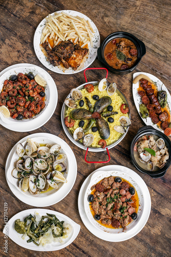 mixed portuguese traditional rustic tapas food selection on wood