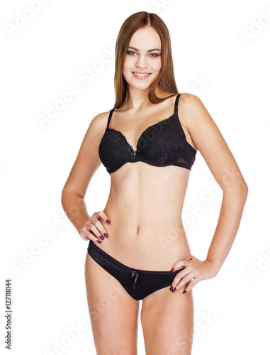 Young brunette woman in black underwear, studio