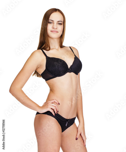 Young brunette woman in black underwear, studio