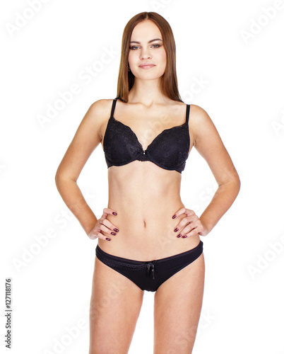 Young brunette woman in black underwear, studio