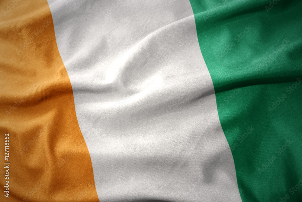 Obraz premium waving colorful flag of cote d'ivoire.