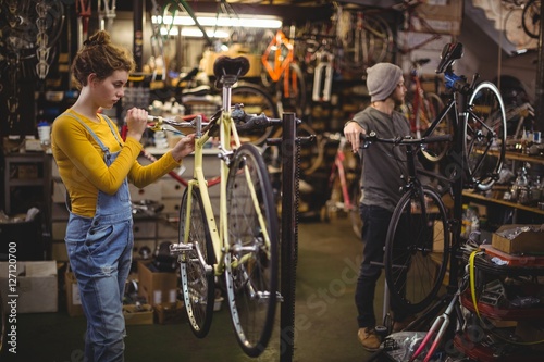 Mechanic repairing a bicycle handle bar