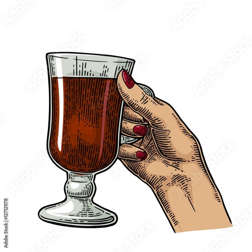 Female hand holding a glass of cocktail, wine, champagne.
