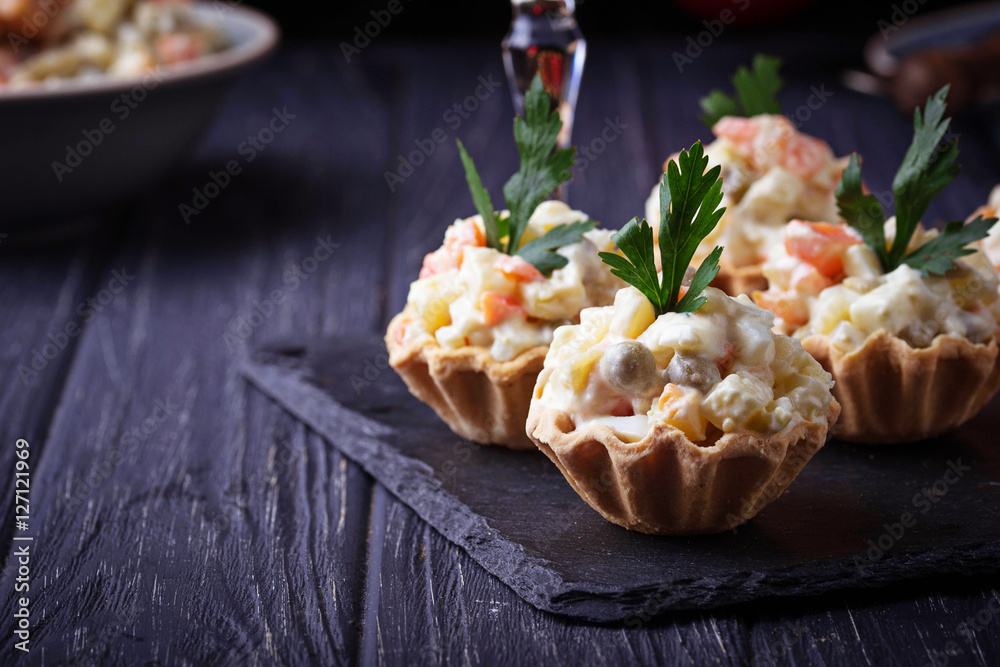 Tartlets with Russian salad, festive appetizer Tartlets with Russian salad, festive appetizer