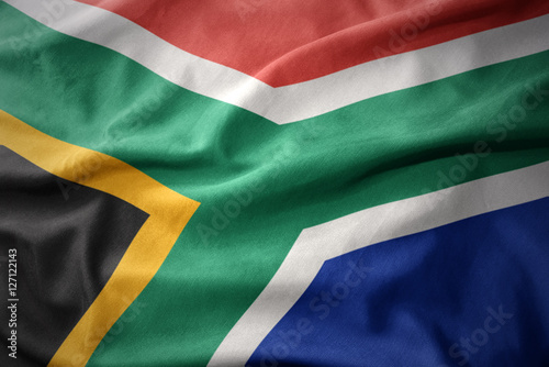 waving colorful flag of south africa.