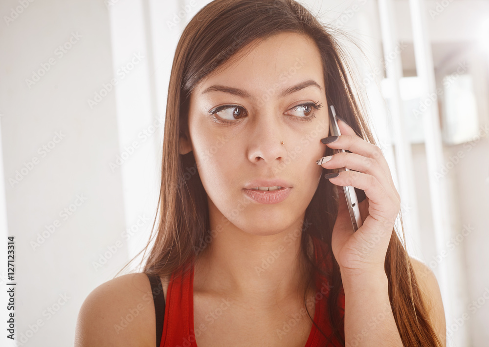 Portrait of young woman talking on smart phone Portrait of young woman talking on smart phone