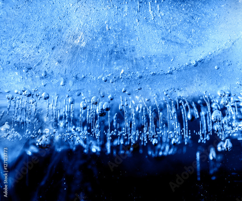 Micro air bubbles in the ice frozen during their movement to the water surface. 1 : 1 macro lens shot