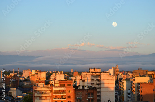 Amanecer en el centro de la ciudad de San Miguel de Tucuman, capital de la provincia de Tucuman, Argentina, super luna sobre el cerro San Javier photo