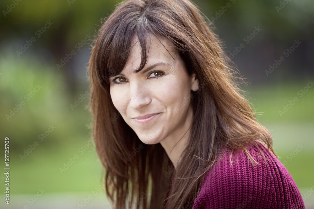 Portrait Of A Woman Smiling At The Camera. Outside. Portrait Of A Woman Smiling At The Camera. Outside.