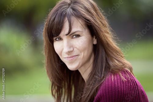 Portrait Of A Woman Smiling At The Camera. Outside.