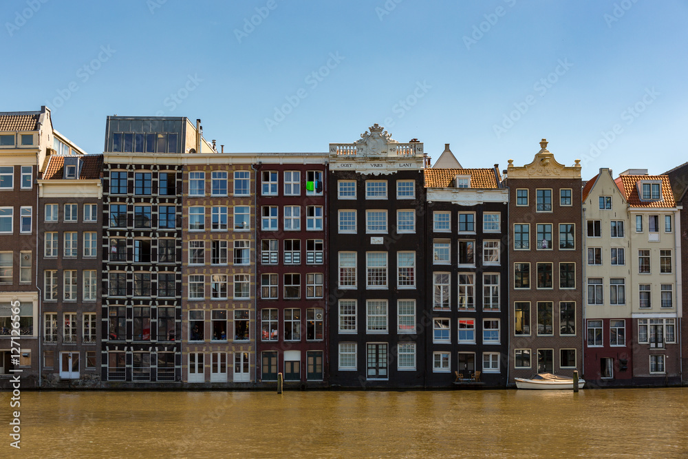 Canalhouse on the Damrak in Amsterdam