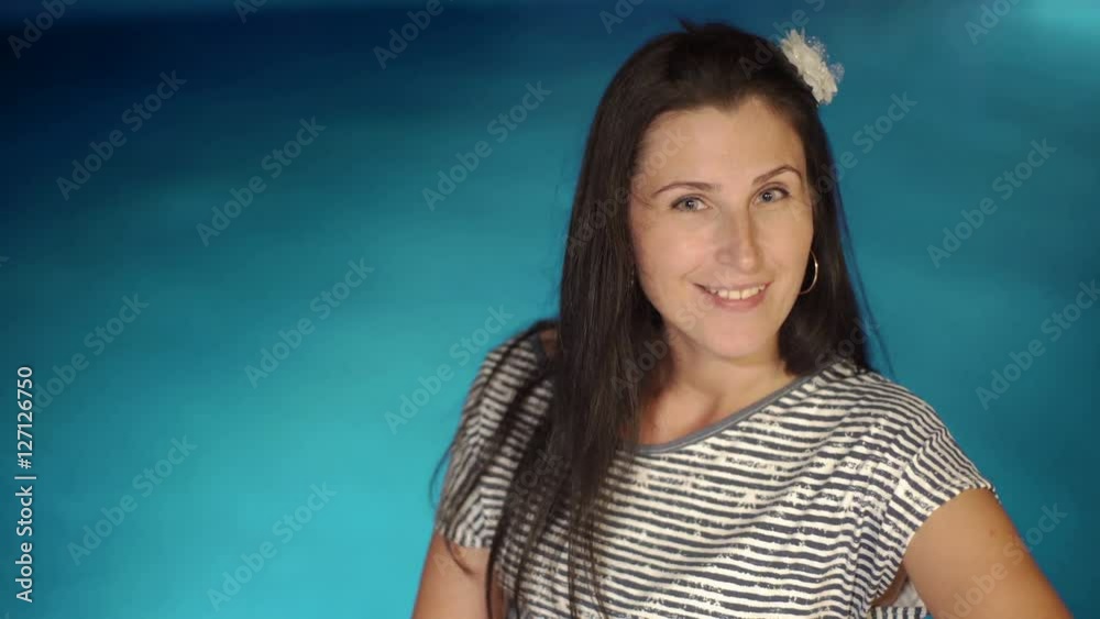 Pretty young smiling brunette women posing near the swimming pool. Summer vacation time. Pretty young smiling brunette women posing near the swimming pool. Summer vacation time.