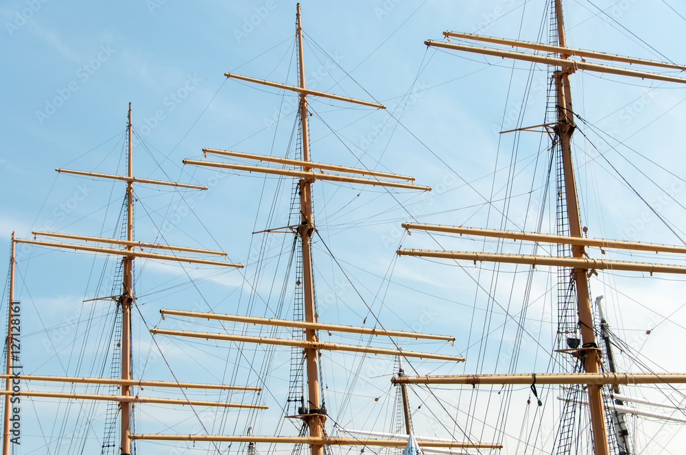 Empty masts of a sailboat on a sunny day