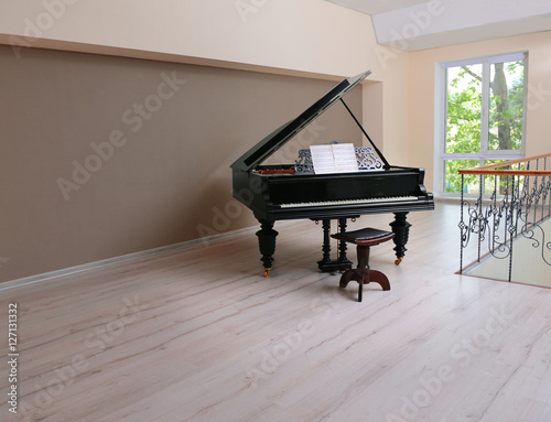 Piano in empty classic room photo