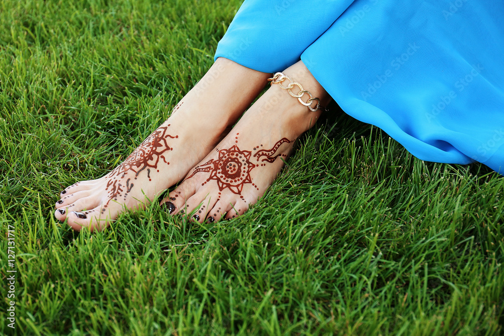A Person Getting a Henna Tattoo on Her Feet · Free Stock Photo