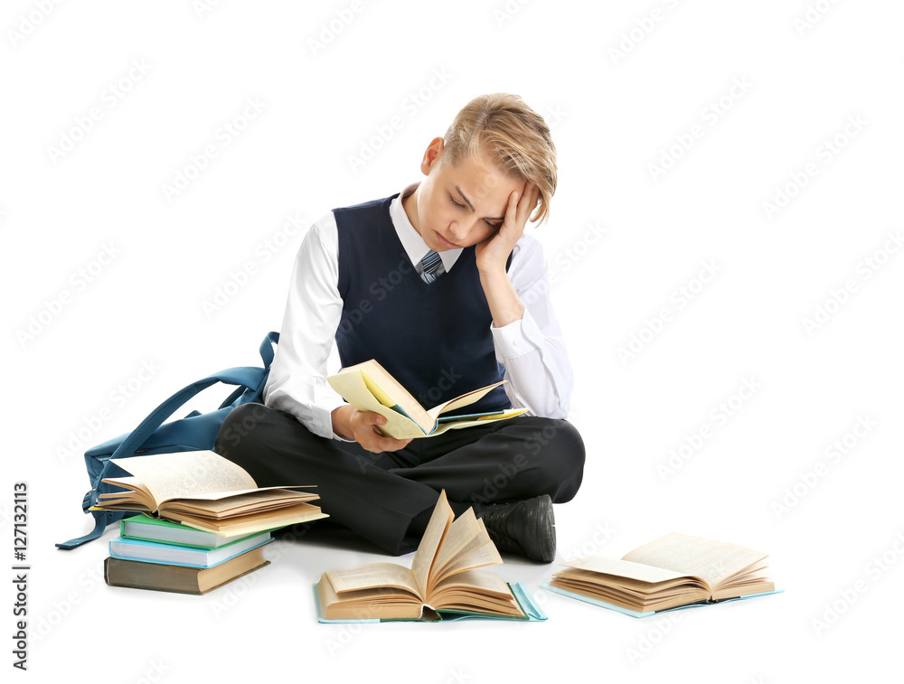 Cute teenager with textbooks on white background Cute teenager with textbooks on white background