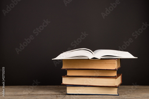 School books on desk, education concept