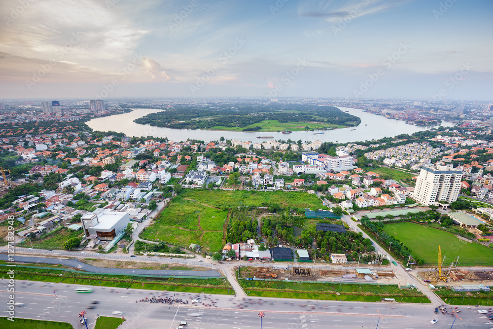 Panoramic view of Thanh Da peninsula, Ho Chi Minh city (aka Saigon) in sunset, Vietnam. Ho Chi Minh city is the largest city and economic center in Vietnam with population around 10 million people.