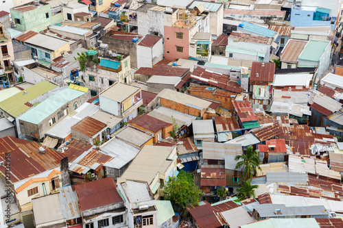 Colorful squatter shacks and houses in a Slum Urban Area in Ho Chi Minh city, Vietnam. Ho Chi Minh city is the largest city and economic center in Vietnam with population around 10 million people.