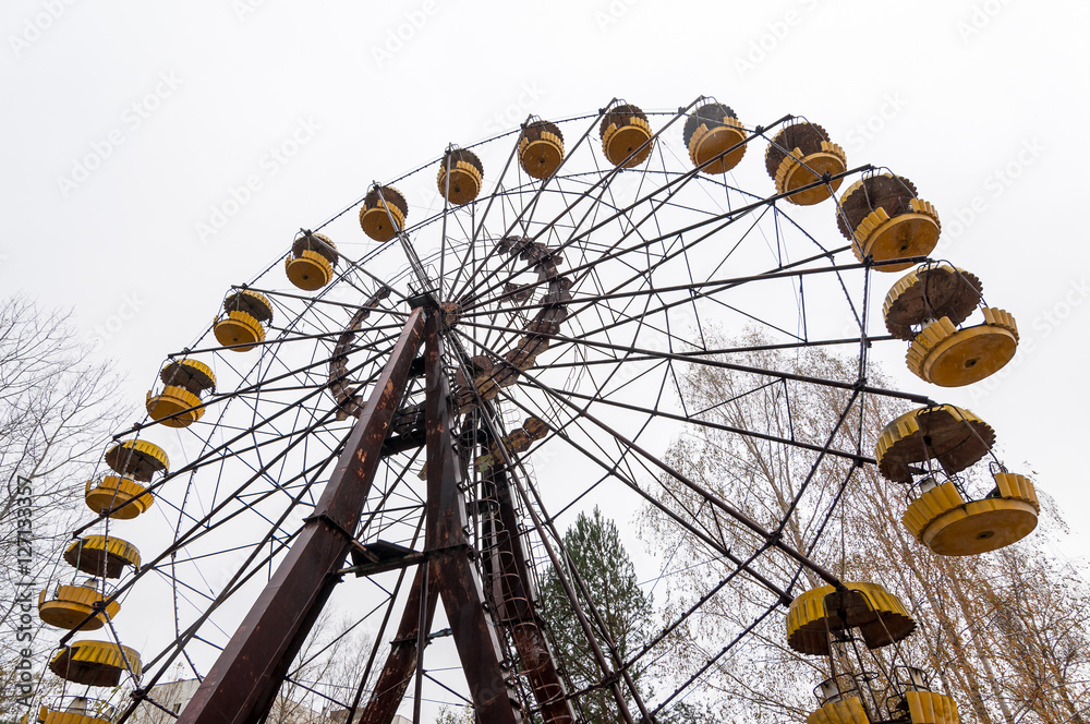 Abandoned wheel of view in pripyat city ghost - town in exclusion radioactiv zone Chernobyl Ukraine. Nuclear dirty place Abandoned wheel of view in pripyat city ghost - town in exclusion radioactiv zone Chernobyl Ukraine. Nuclear dirty place