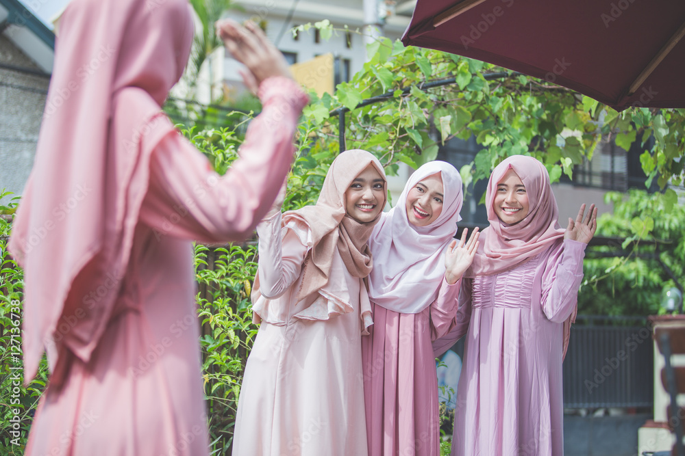 woman greeting her friend and say hi