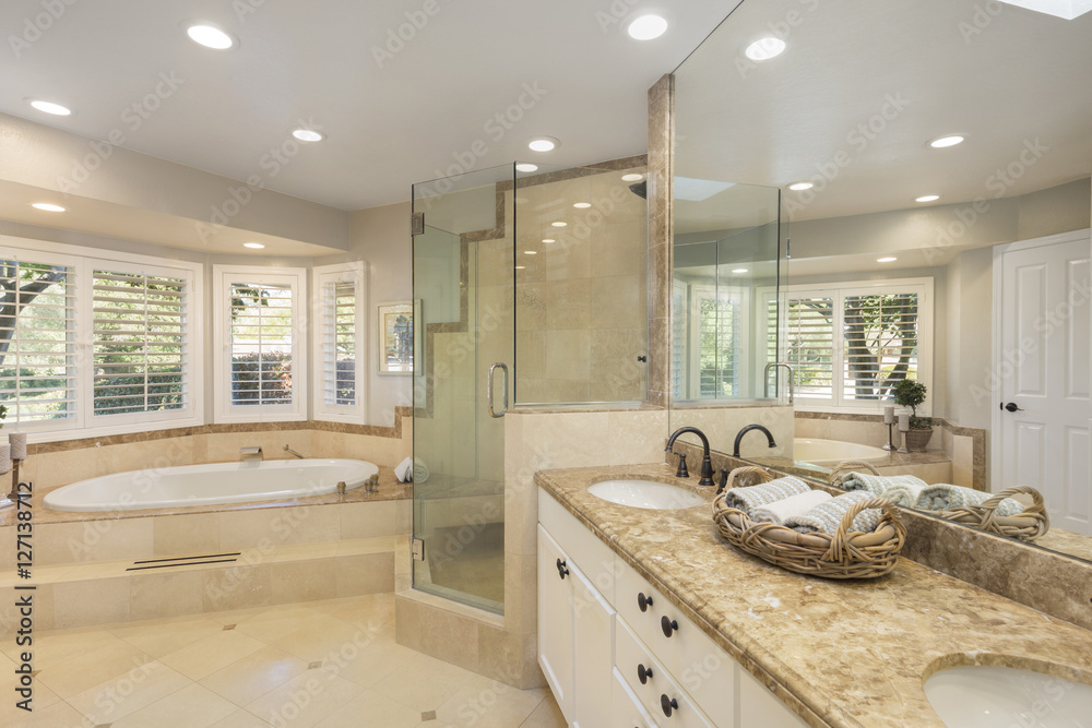 Luxury bathroom interior in marble with glass shower and oval bath tub and  round shaped double sink. Stock Photo | Adobe Stock