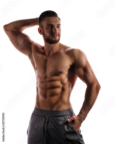 Bodybuilder Posing. Beauty male body.