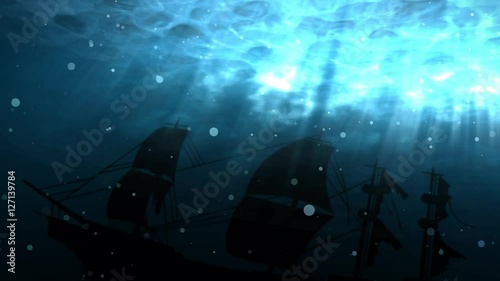 Seamless animation of deep blue ocean with shipwreck background. Ship sunk in undersea water as a silhouette background. With bubbles and light shinning through the sea water surface in 4k hd loop.