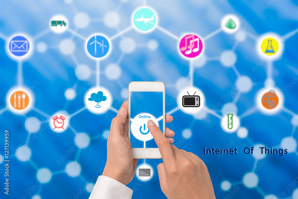 Hand holding smart phone with online power button Internet of th Hand holding smart phone with online power button Internet of th