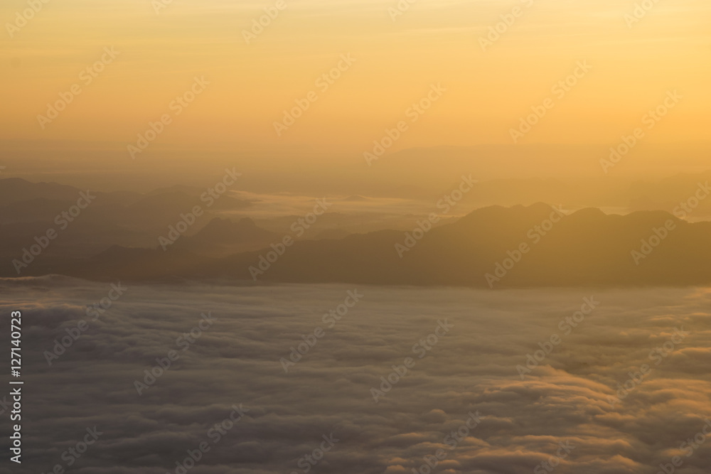 panoramic view of mountain with fog and cloud during sunrise