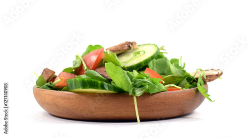 Fresh arugula salad on plate