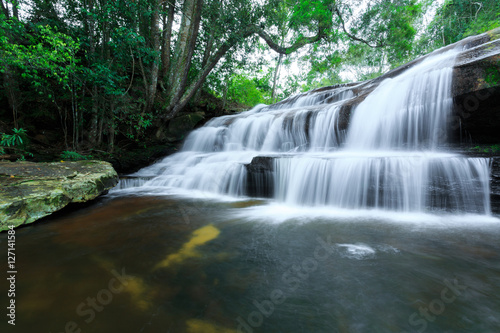 The landscape photo, beautiful rainforest waterfall in deep forest at Phu Kradueng National Park in Thailand © cakeio