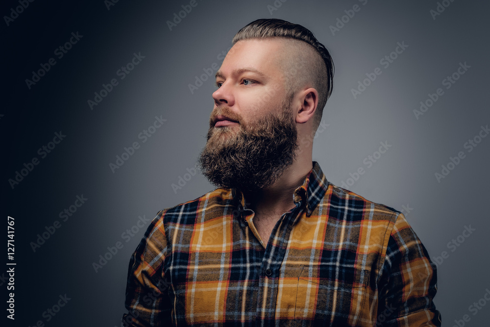 Fototapeta premium Portrait of a bearded male with punk hairstyle.