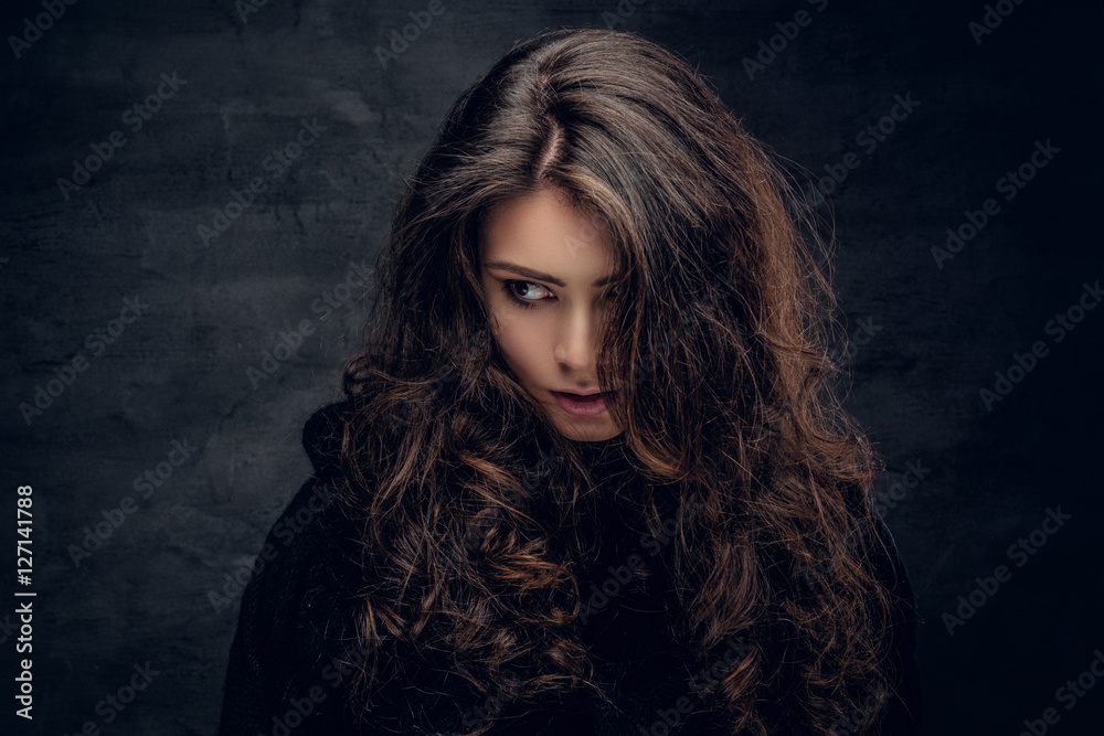 Brunette female dressed in a black sweater. Brunette female dressed in a black sweater.