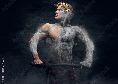 Ancient male athletic warrior with sword.