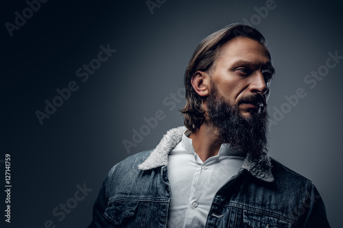 Bearded male with long hair.