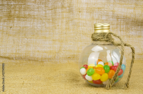 Colorful candies in bottles with shallow depth of field (dof) photo