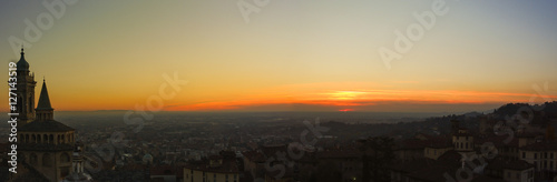 Bergamo - Old city (Citta Alta). One of the beautiful city in Italy. Lombardia. Evening sunset. Landscape on the old city, Cathedral, clock towers and the Po Valley. 