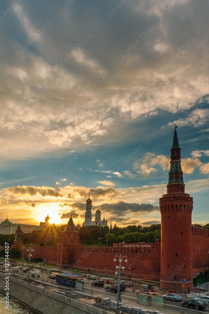Kremlin wall and churches on the sunset background