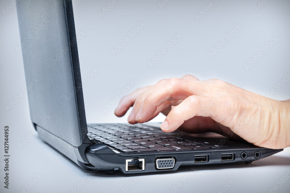 Pair of Hands Typing on Laptop Keyboard Pair of Hands Typing on Laptop Keyboard