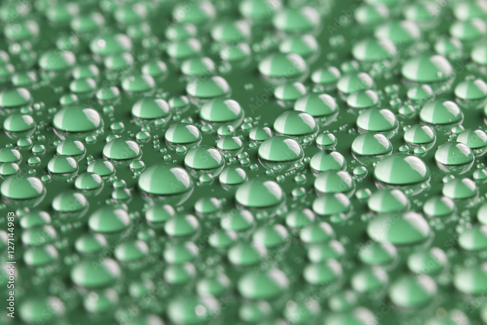 water drops on green background water drops on green background