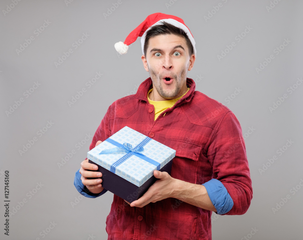 Guy holding a christmas gift Guy holding a christmas gift