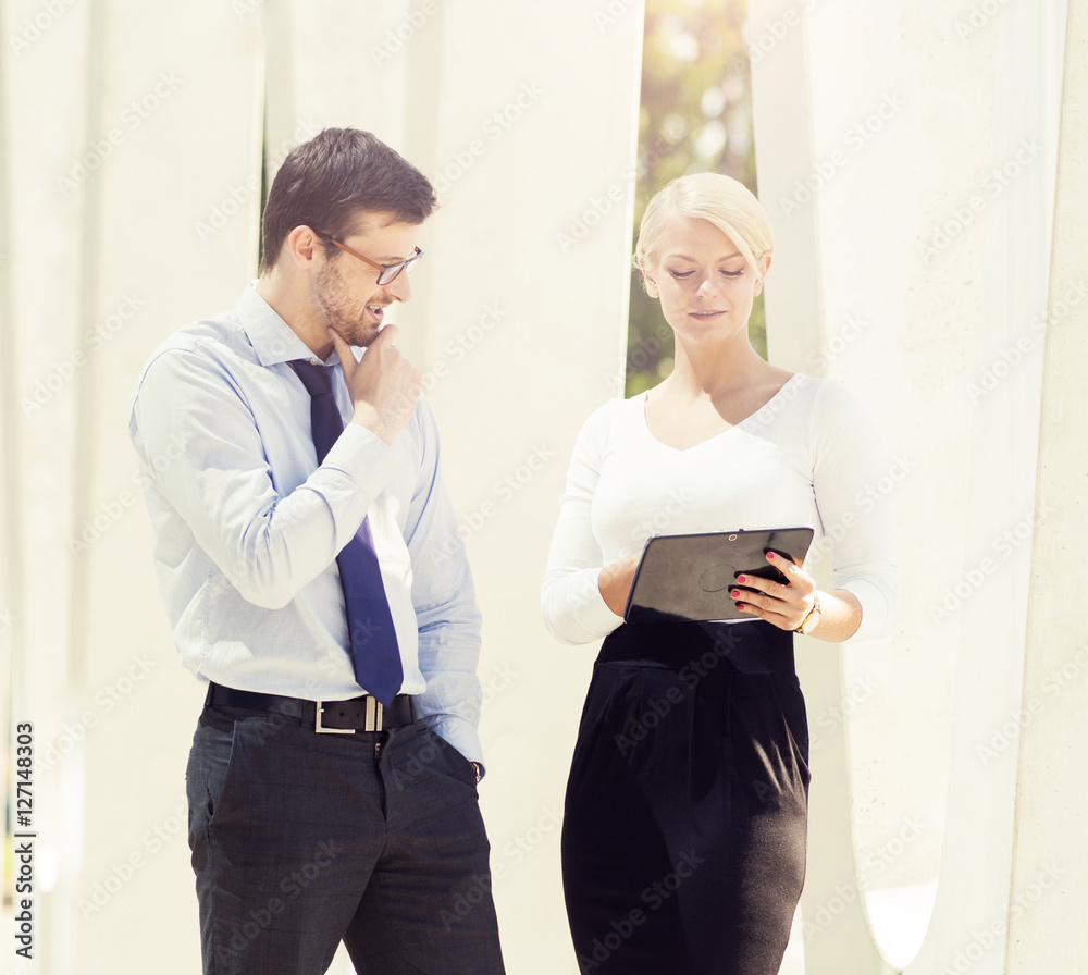 Young man and woman having an outdoor meeting Young man and woman having an outdoor meeting