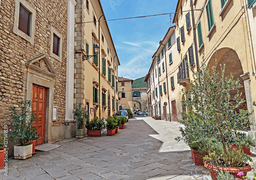Narrow old street with flowers in Italy © arbalest