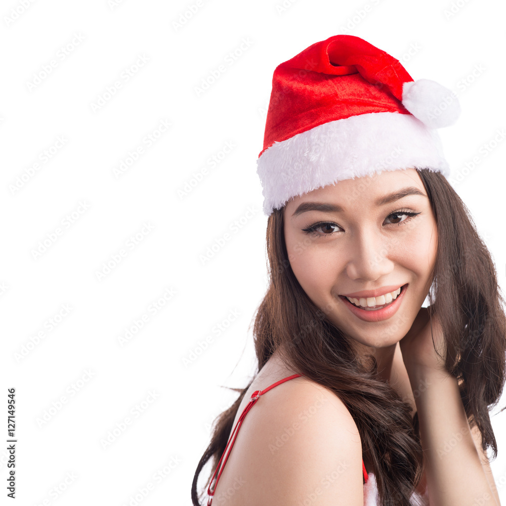 Christmas Woman. Beauty Asian Model Girl in Santa Hat isolated o Christmas Woman. Beauty Asian Model Girl in Santa Hat isolated o