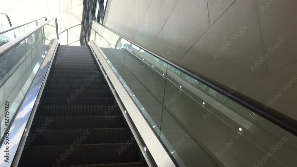 modern escalator in shopping center. modern escalator in shopping center.