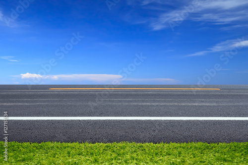 Green grass on road.