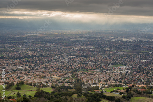 Aerial View of the Silicon Valley, Green Countryside, and Ominous Sky. San Jose and Southern Silicon Valley as seen from Mount Hamilton in the Fall of 2016.