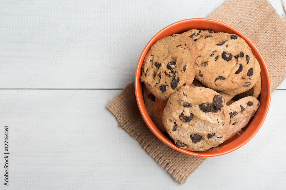 Chocolate chip cookies in orange bowl Chocolate chip cookies in orange bowl
